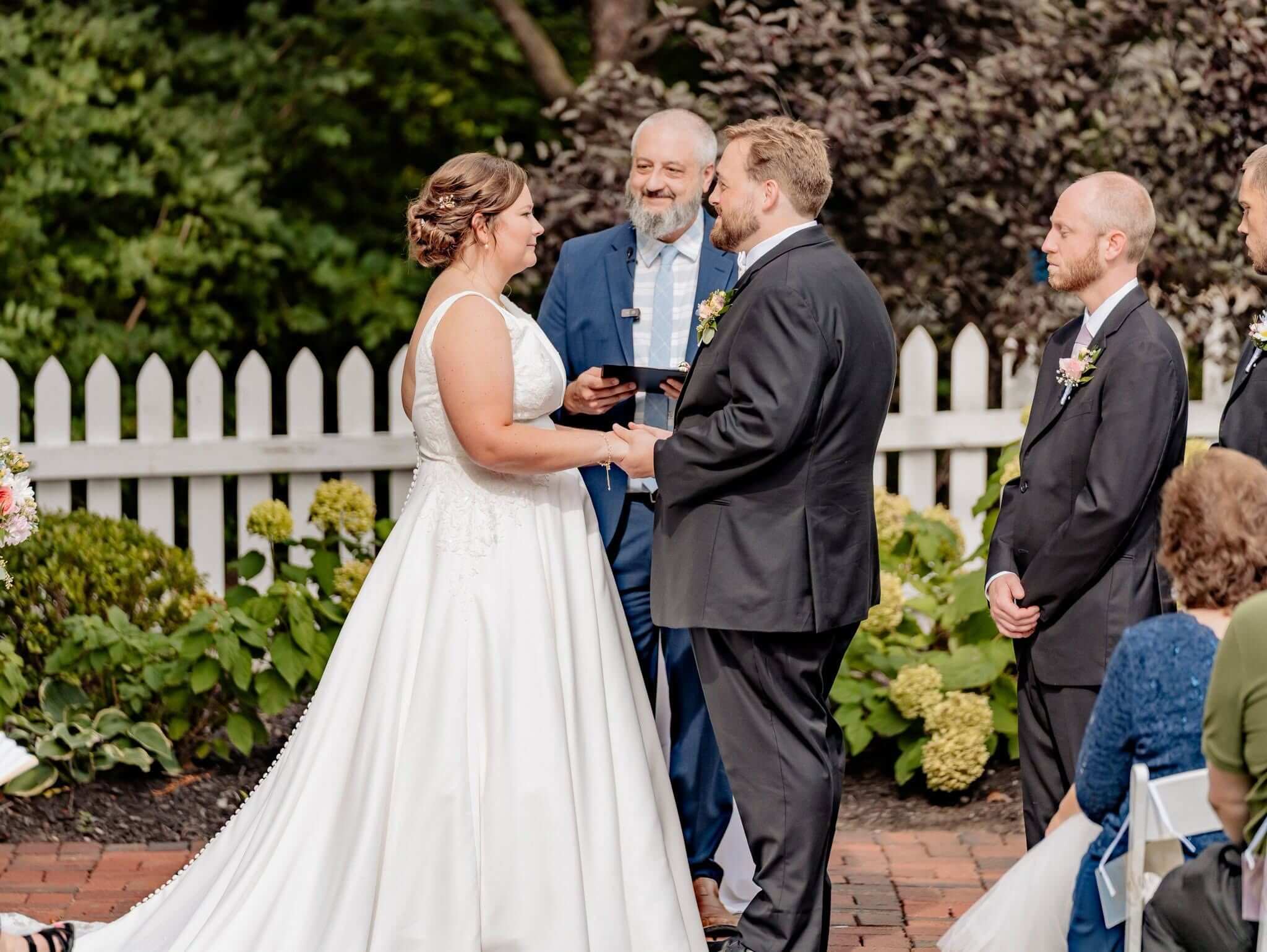 Tim Parsons officiating an outdoor garden wedding ceremony